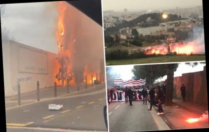 Raging Marseille fans set fire to tree, let off fireworks and 'storm training ground' in protest hours before Rennes tie
