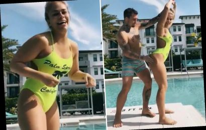 Paige VanZant gets bum slapped while wearing sexy one-piece as ex-UFC star frolics around with husband by pool