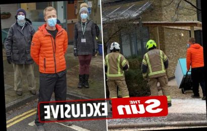 Pictured: Humble doctor who saved Covid vaccines from fire praises staff for jab rollout – and he's already back at work