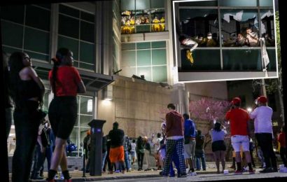 Uprising of '40 inmates' in St Louis prison riot smashing windows & starting fires as onlookers CHEER from sidewalk