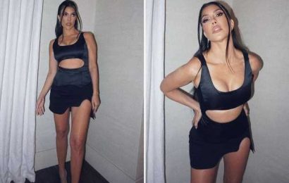 Kourtney Kardashian stuns and almost slips out of tiny black dress as boyfriend Travis Barker calls star 'my vampire'