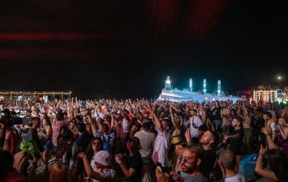 Music fans flock to Albania’s beach festival despite virus