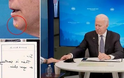 Aide passes Biden note saying &apos;Sir, there is something on your chin&apos;