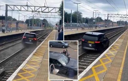 Dramatic moment 4×4 flees along TRAIN TRACKS at Cheshunt station after being stopped by cops