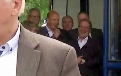 Outrage as German minister is caught LAUGHING when visit town devastated by floods as death toll rises to 143