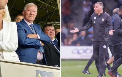 Man Utd icon Sir Alex Ferguson watches on from Luton stands as Peterborough boss son Darren is booked for rowing