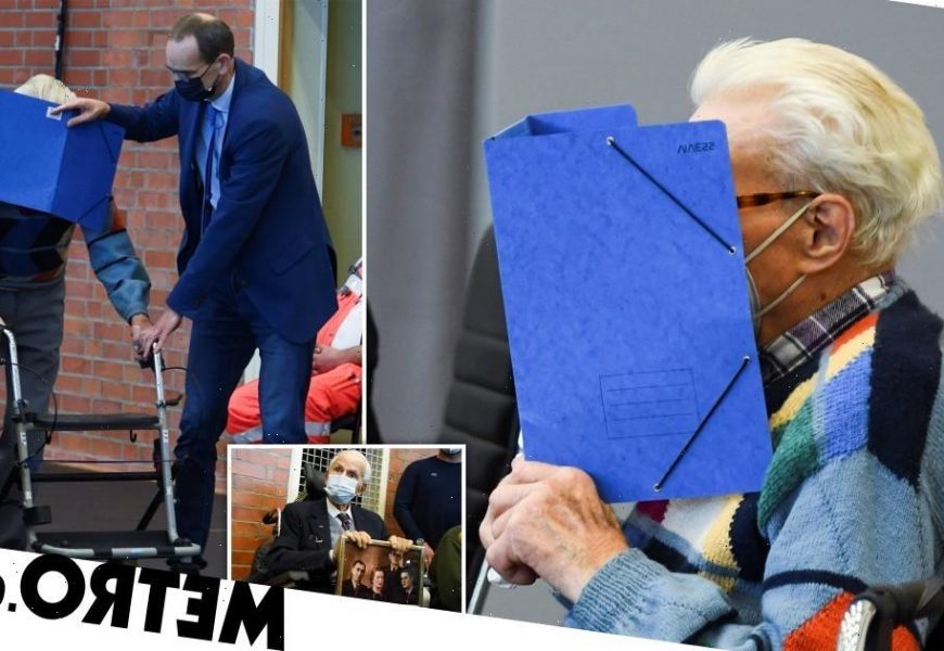 Cowardly Nazi guard, 100, covers his face as he's finally brought to trial