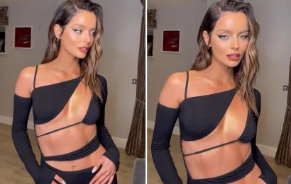 Maura Higgins leaves little to imagination as she flashes her toned abs in racy cut-away black dress
