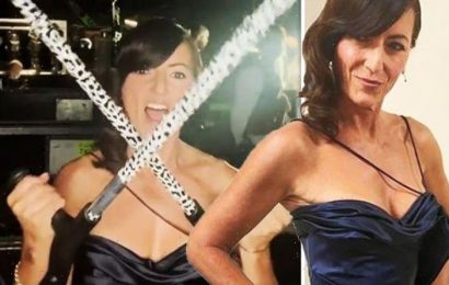Davina McCall stuns in jaw-dropping dress as she relies on crutches amid foot injury