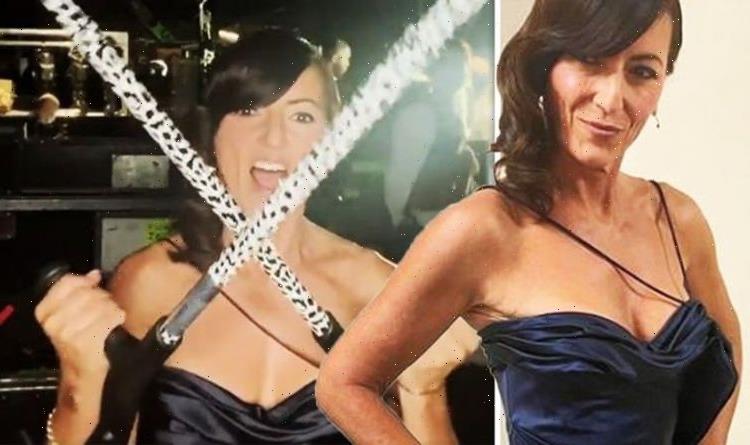 Davina McCall stuns in jaw-dropping dress as she relies on crutches amid foot injury