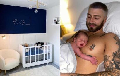 Inside Jake Quickenden's stylish nursery for baby Leo with dark feature wall and personalised name sign