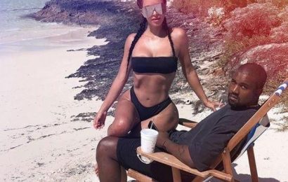 Kim Kardashian sizzles in a black bikini as she perches on Kanye West's lap… but he looks completely bored