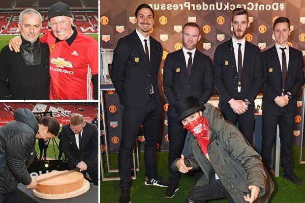 Manchester United's Wayne Rooney and Zlatan Ibrahimovic cut a giant CHEESE on the pitch to help show off the new club TAG Heuer watches (but boss Jose Mourinho looked glum in the stands)