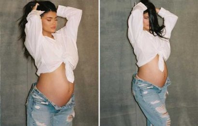 Pregnant Kylie Jenner shows off bare baby bump in crop top and unzipped jeans- after fans suspect she already gave birth