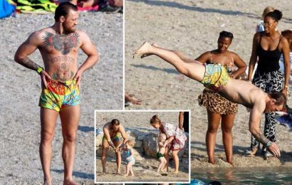 Conor McGregor shows off shredded physique and still in fighting fit shape after UFC return hint on family beach holiday