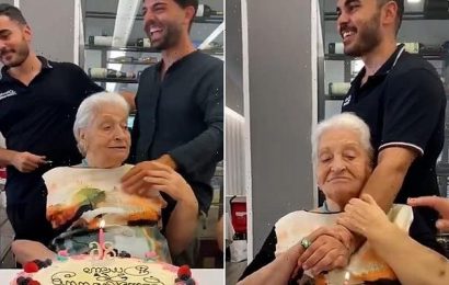 Grandmother caresses waiter&apos;s arm, mistaking him for her grandson