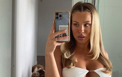 Pregnant model wears extreme crop top to celebrate blossoming baby bump
