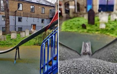 Is this Britain's most depressing playground? Kids play on metal slide just metres from a GRAVEYARD
