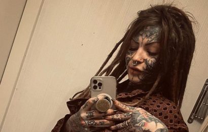 Tattoo artist with hundreds of inkings ditches bottoms to flaunt hot body