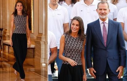 Queen Letizia shows off toned arms as she steps out with King Felipe