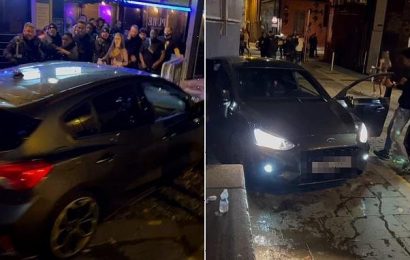 Furious crowd smash up car after driver &apos;tried to run them over&apos;