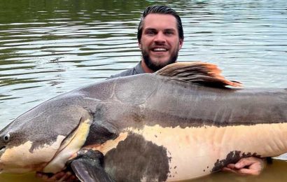 Ex-Chelsea midfielder catches nine-stone catfish as he enjoys day off… but can you guess who it is? | The Sun