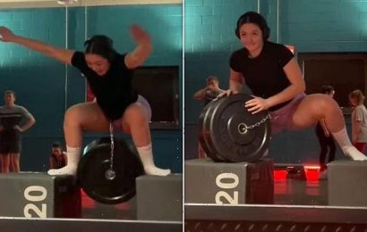 Gym lover takes tumble as she attempts risky squat exercise
