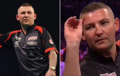 Whistler in darts crowd triggers Nathan Aspinall with ref forced to intervene
