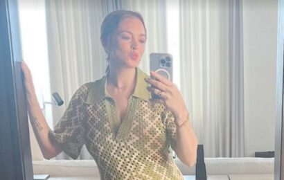 Lindsay Lohan shows off her growing baby bump for first time