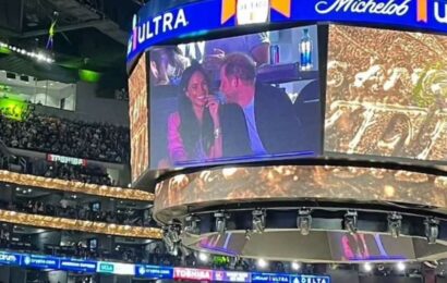 Meghan Markle & Prince Harry tease fans as they giggle and pull faces on 'kiss cam' at Lakers game after coronation snub | The Sun