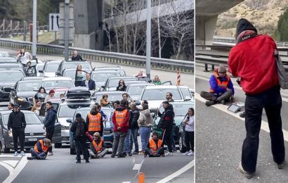 Swiss motorists rip banners from protesters&apos; hands
