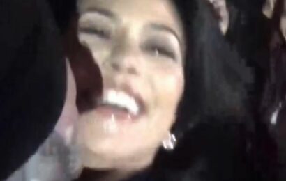 Kourtney Kardashian’s husband Travis Barker jumps off stage to kiss star after baby news