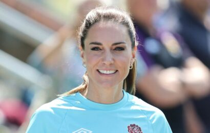 Princess Kate shows off her sporty side in navy tracksuit and rugby union shirt