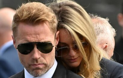 Heartbroken Ronan Keating comforted by wife Storm at brother’s funeral