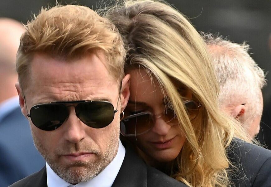 Heartbroken Ronan Keating comforted by wife Storm at brother’s funeral