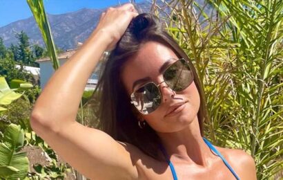 British boxing legend's stunning model wife almost spills out of blue bikini as fans hail her 'absolutely stunning' | The Sun