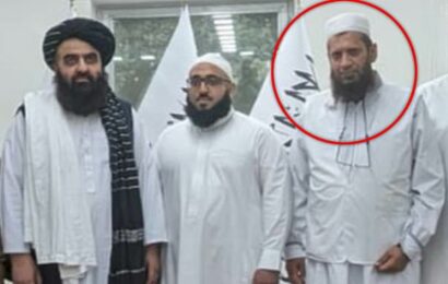 NHS chaplain triggers outrage as he poses with the Taliban on holiday