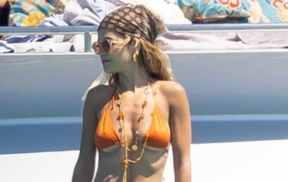Rita Ora looks incredible as she strips down to thong bikini to paddleboard with Hollywood star husband | The Sun