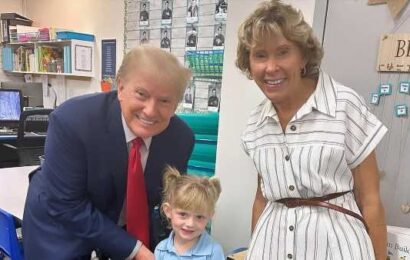 Donald Trump holds granddaughter Carolina&apos;s hand at school