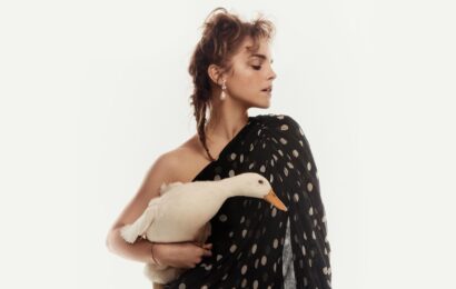 Emma Watson stuns as she poses in black polka dot dress holding a duck for Vogue | The Sun